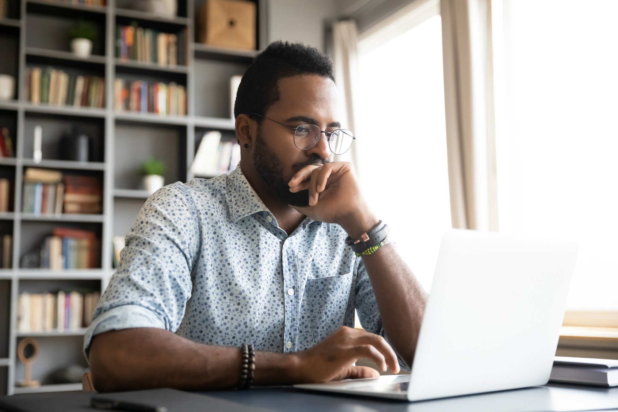 Consumer-looking-at-laptop-June-7-2023